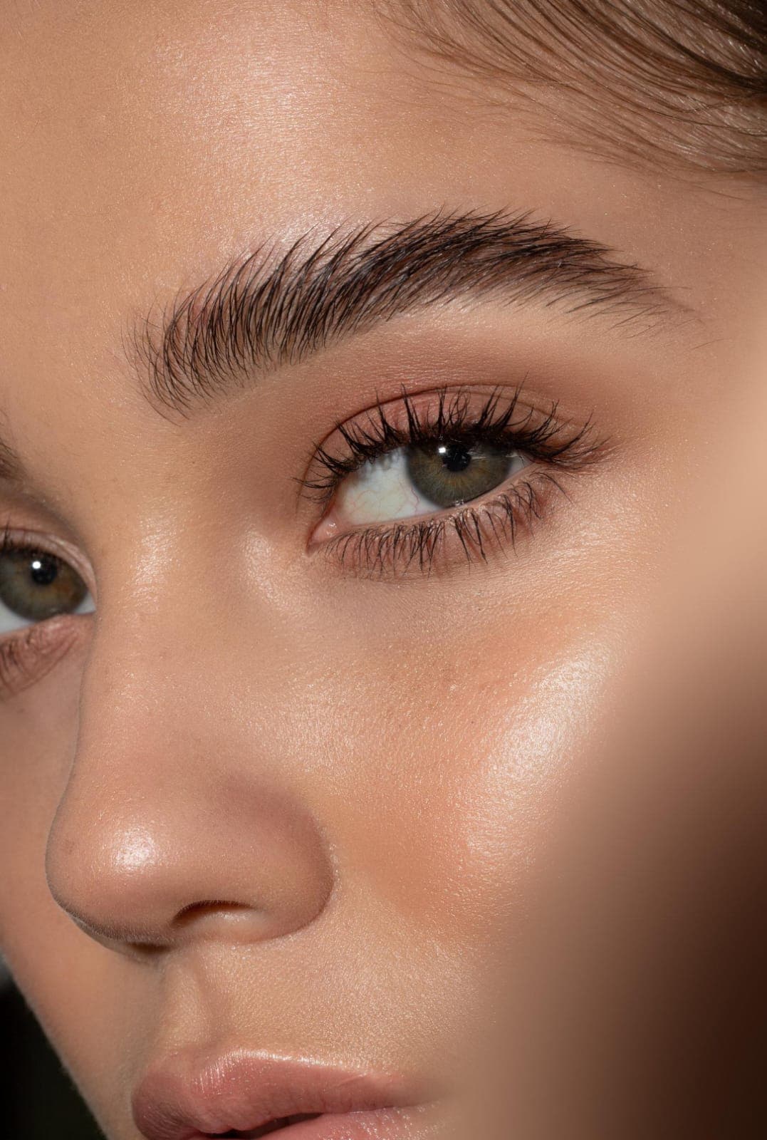 Close up of softly shaped, well defined brows with a fresh, laminated finish